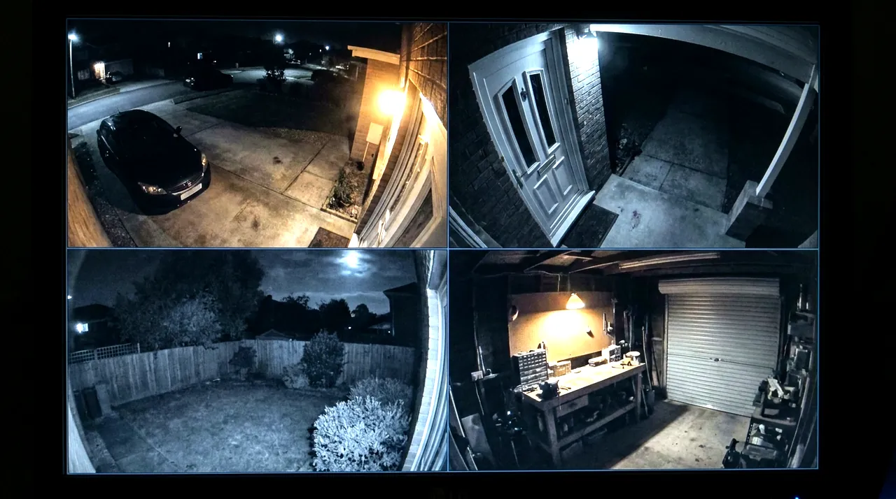 Four security camera views at once: a driveway with a parked car, a front door, a back garden and a workshop